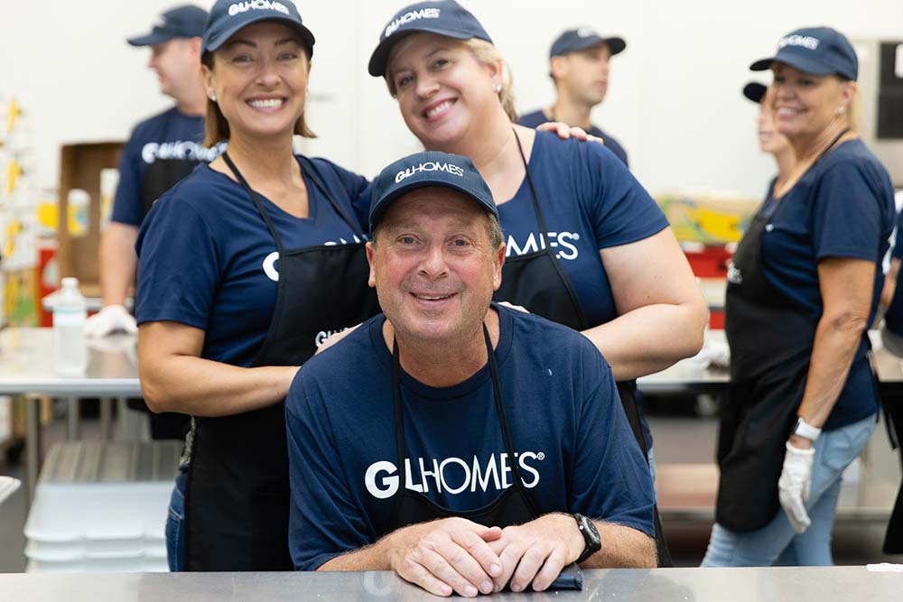 GL Homes volunteers to prep meals for Feeding South Florida event.