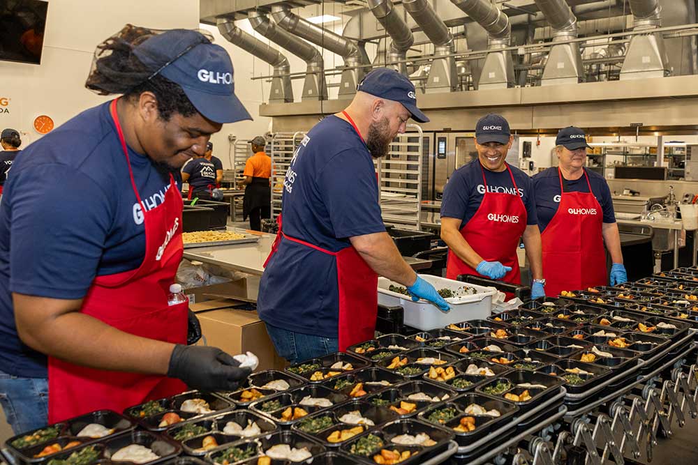 GL Homes volunteers prep food for Feeding South Florida.