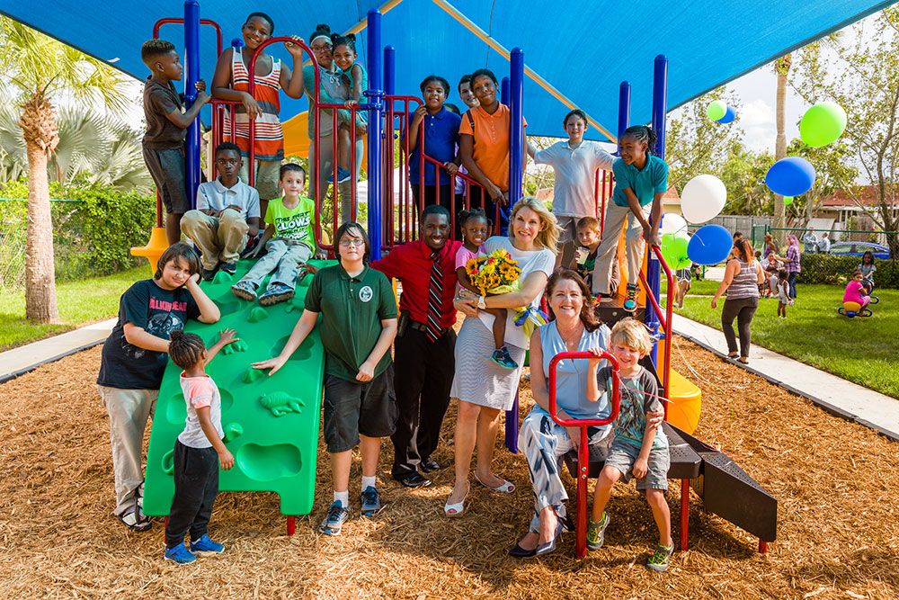 Children enjoy the new playground at The Lord's Place in West Palm Beach, Florida