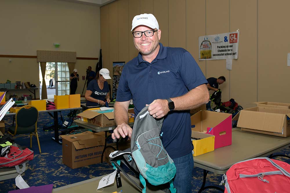 GL Homes at backpack giveaway
