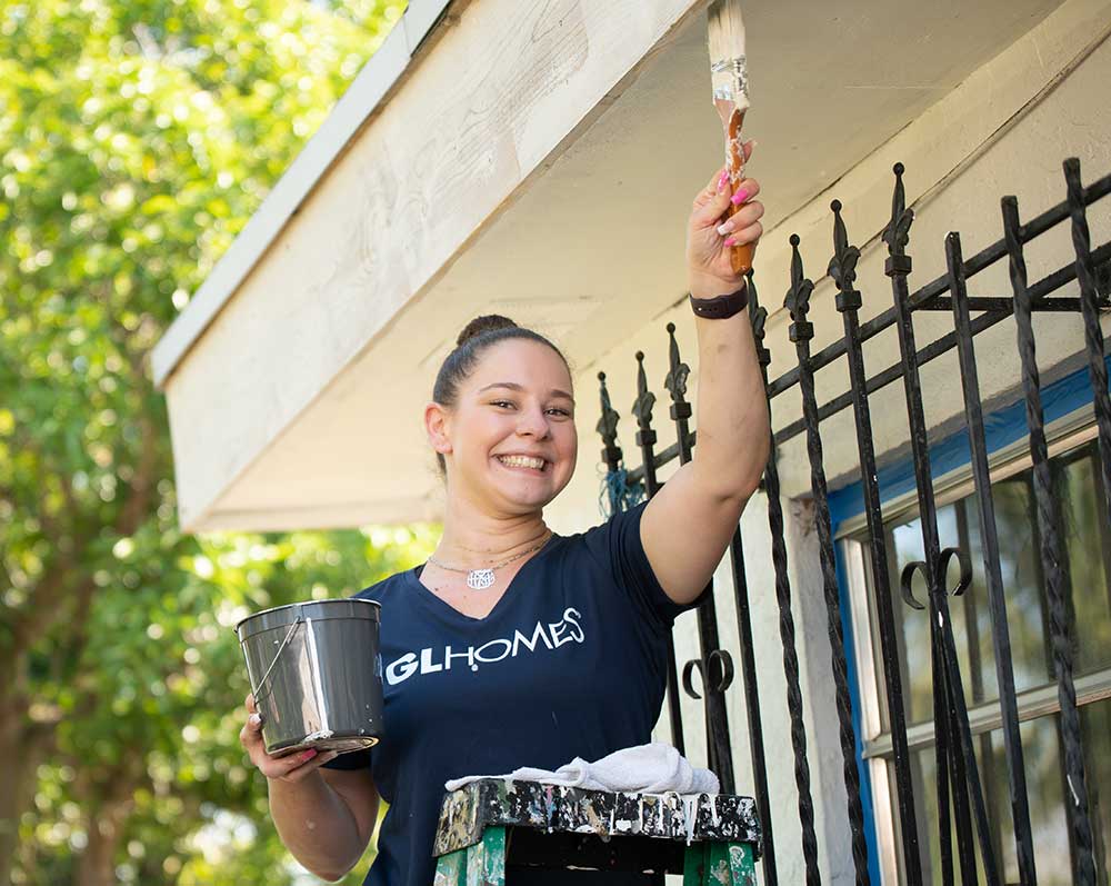 A GL Homes volunteer painting a home in Delray Beach, Florida.