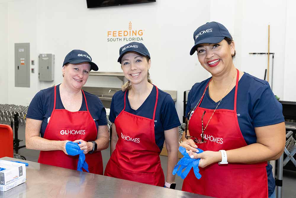 GL Homes makes meals for seniors at Feeding South Florida event.