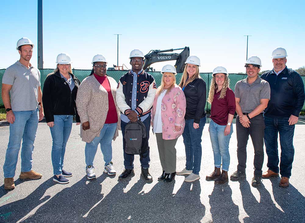 The GL Homes team with Youth of the Year Finalist at a construction site in Boynton Beach, Florida.