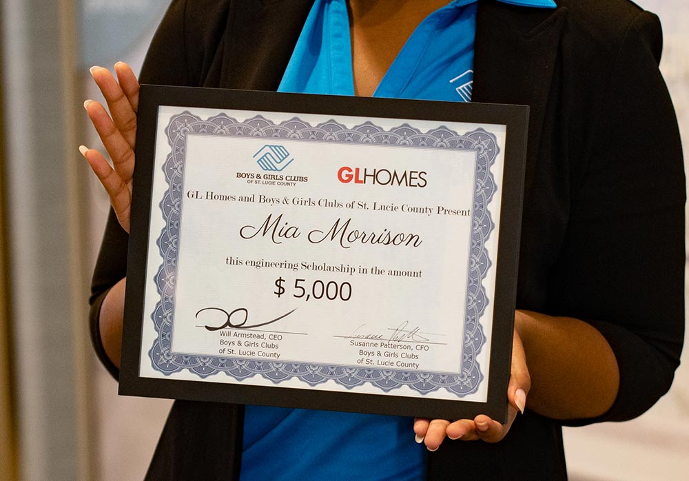 The GL Homes Engineering College Scholarship is presented to Mia Morrison.