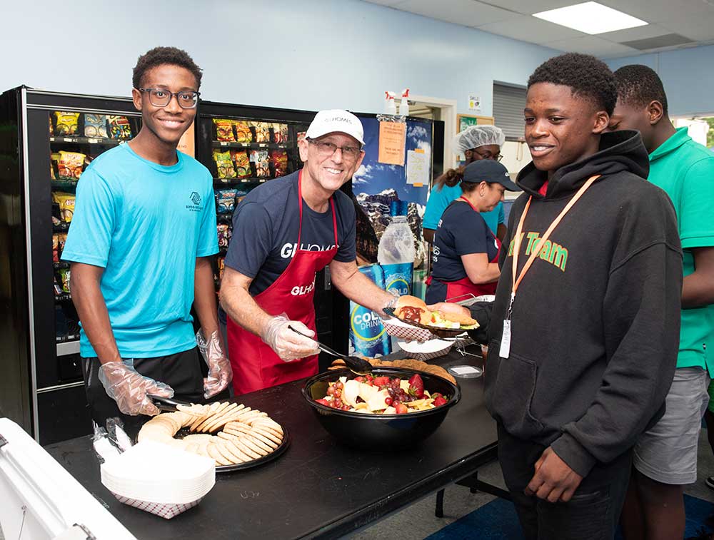 GL Homes serves up hot meals to Boys & Girls Clubs members. 