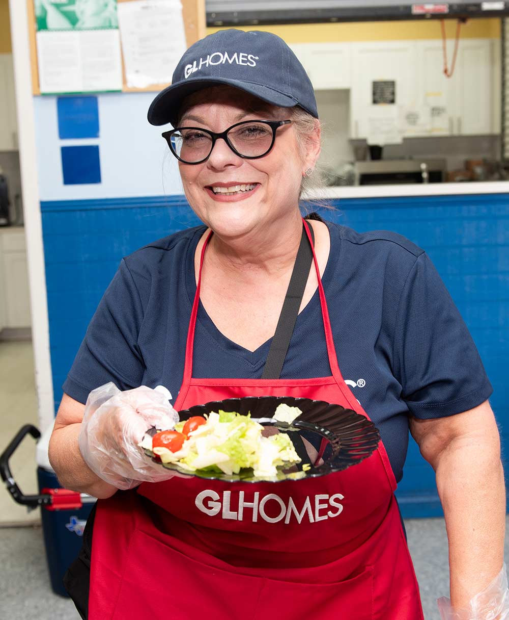 GL Homes employees volunteer to support the Boys & Girls Clubs kitchen staff.