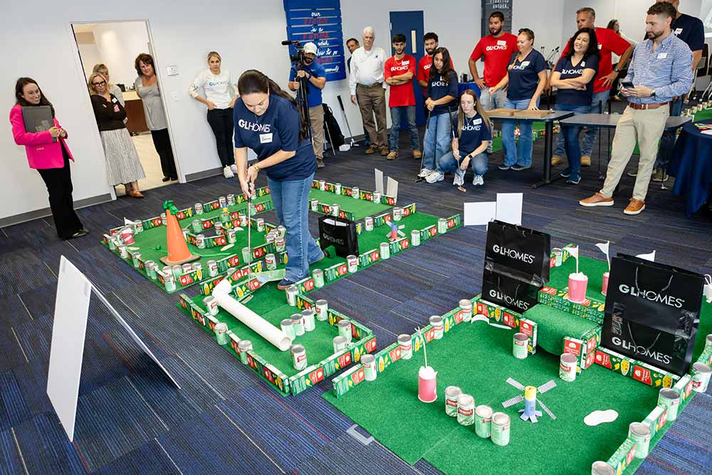 GL Homes plays mini-golf at Harry Chapin Food Bank distribution center.